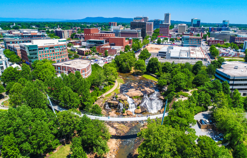 Downtown Greenville skyline aerial of Falls Park and Liberty Bridge.