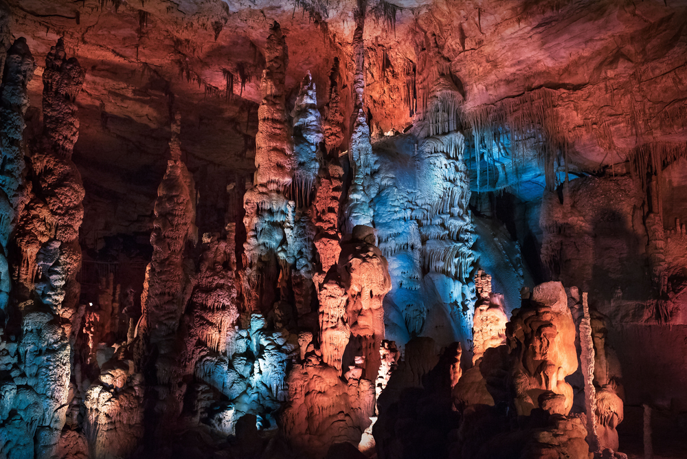 Inside the Cathedral Caverns lit with blue and red lights.
