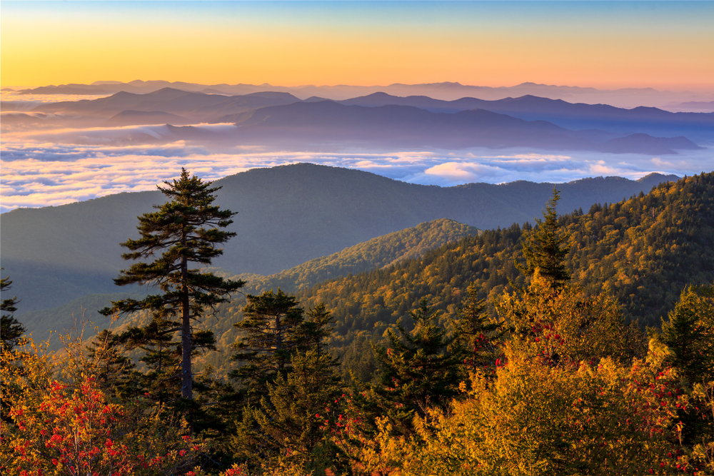 Sunset over the Smoky Mountains with fog in the distance.