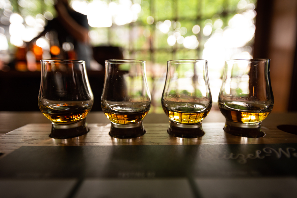 close up on four glasses of tasting along the kentucky bourbon trail