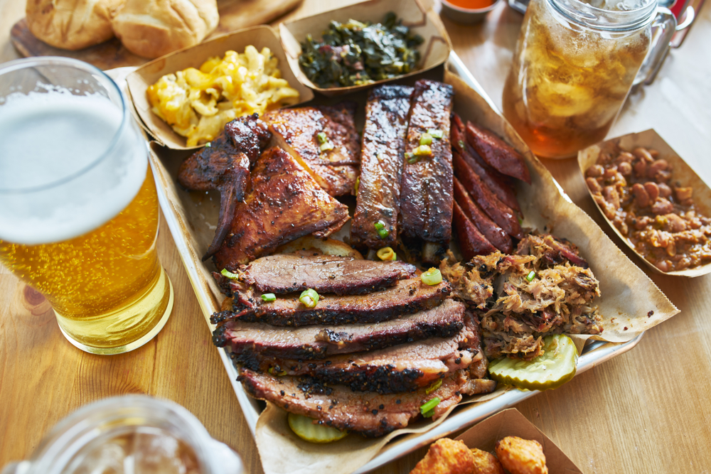 a yummy platter of nc bbq and sides with beer and sweet tea. 