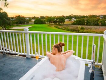 Pretty sunset with a women relaxing in a hot tub in Charleston SC
