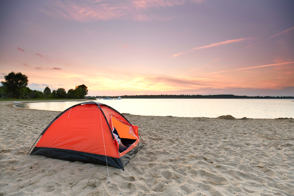 Photo of a tent on Little Elm Beach at sunset! 