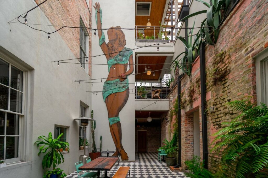 A picture of the open air courtyard at the Selina Catahoula hotel, one of the best boutique hotels in New Orleans