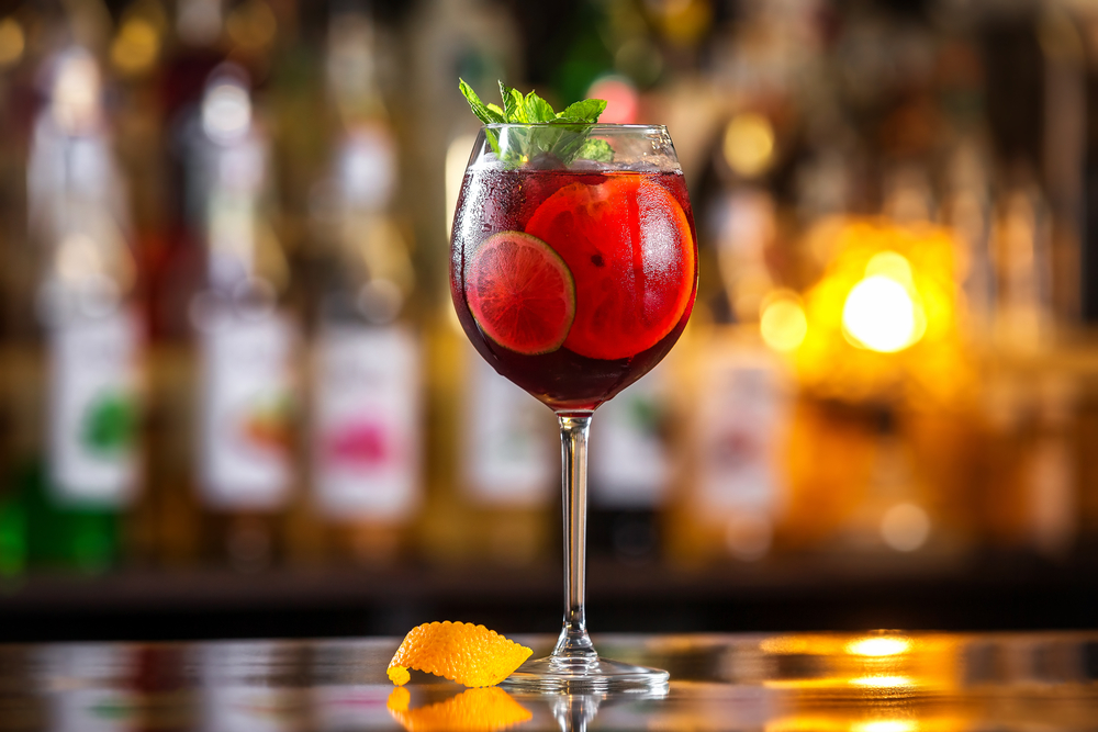 glass of sangria on bar