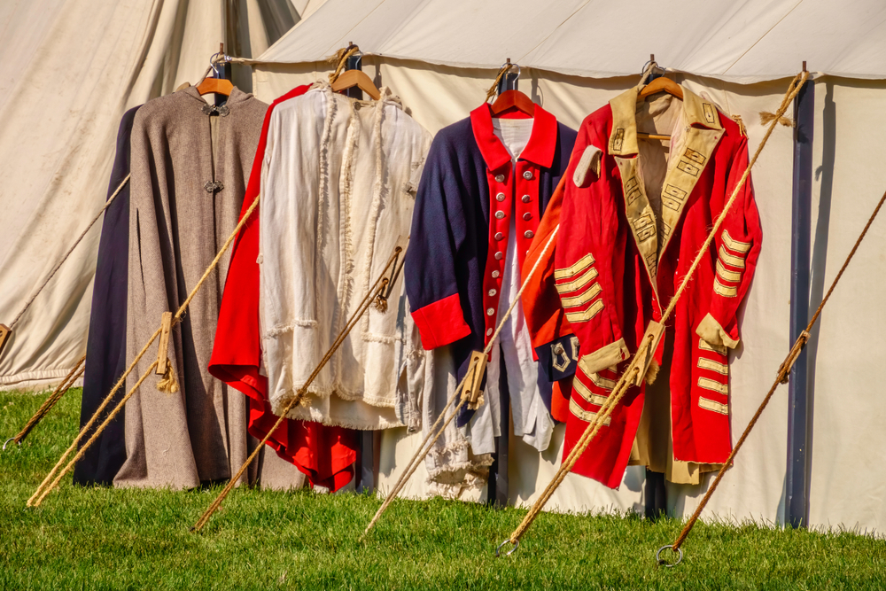 reenactment uniforms hanging from posts in state park