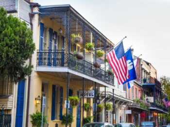 american flags outside one of the most haunted hotels in New Orleans