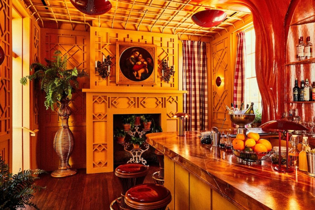 photo of the kitchen wood bar with barstools and fruit and hotel Peter and Paul, one of the hotels in New Orleans 