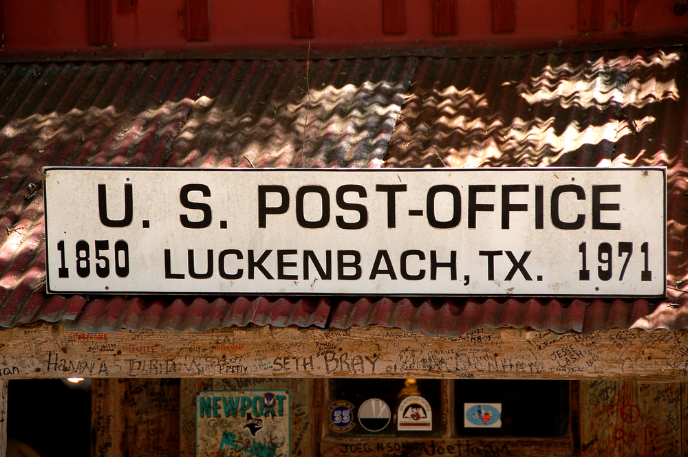 The sign outside of the Post Office in the tiny town of Luckenbach Texas, one of the best hidden gems in Texas. 