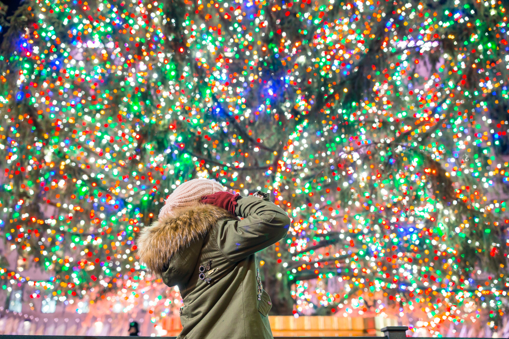 a kid in front of a bunch of colorful Christmas lights in Virginia 
