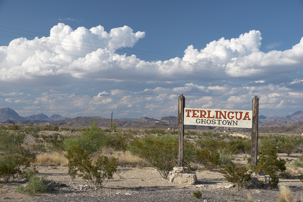 The sign outside the Terlingua Ghost Town that is kind of dilapidated and seemingly in the middle of nowhere.