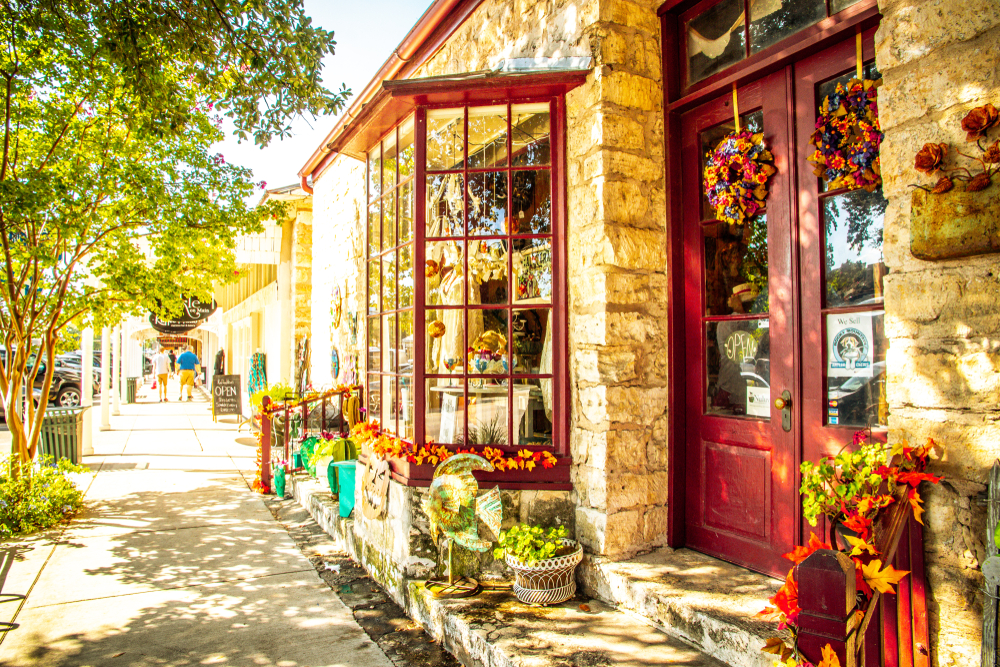 The Main Street in Frederiksburg, Texas, also known as "The Magic Mile", with retail stores and poeple walking