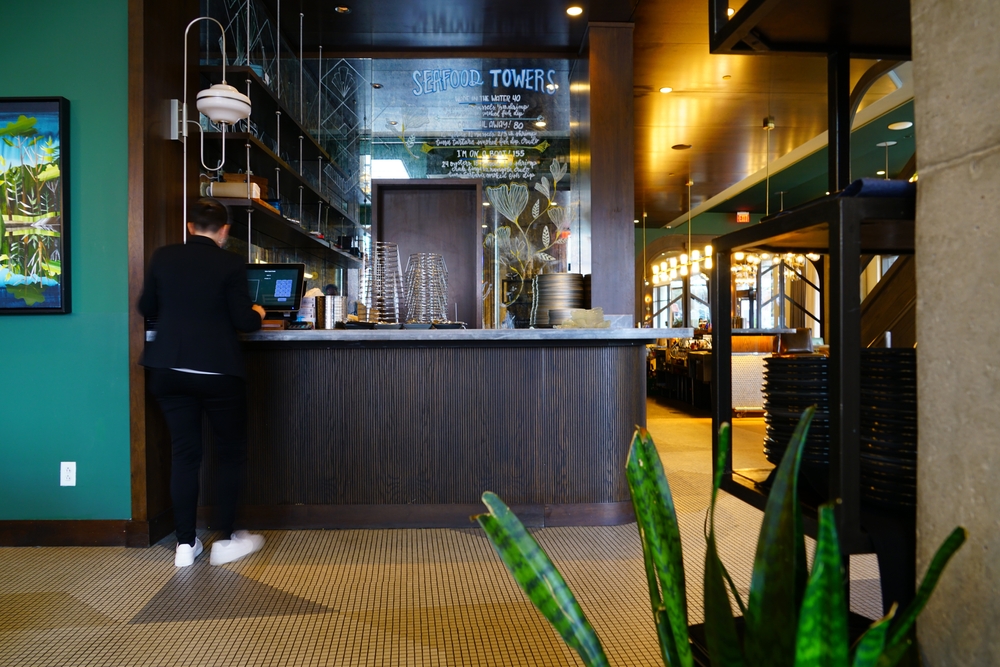 Boutique hotels are to die for, and are where to stay in Nashville. They stand out-- like this one-- which has a self-serve coffee bar in the lobby. A man stands at the bar and makes his own order. 