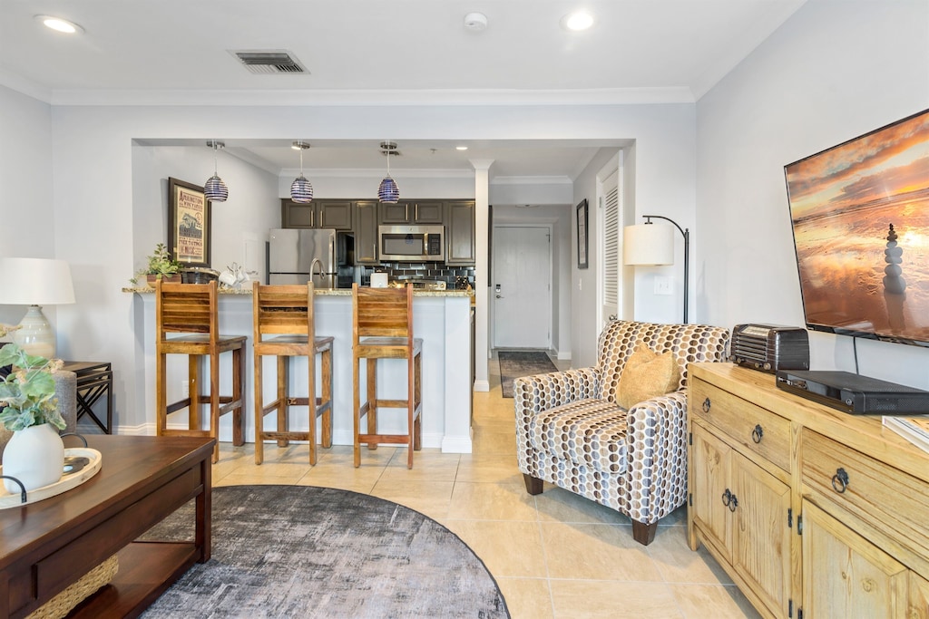 Cute little condos are perfect for where to stay in Nashville: this one features a small kitchenette with chairs, and living room, and more. 