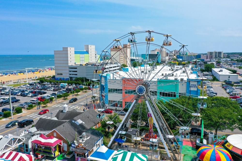 The oceanfront in Virginia Beach with a Ferris wheel in the summer time 