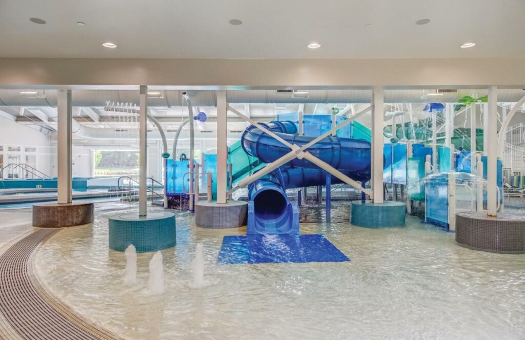 The indoor pool with fun slides at one of the best family resorts in NC 