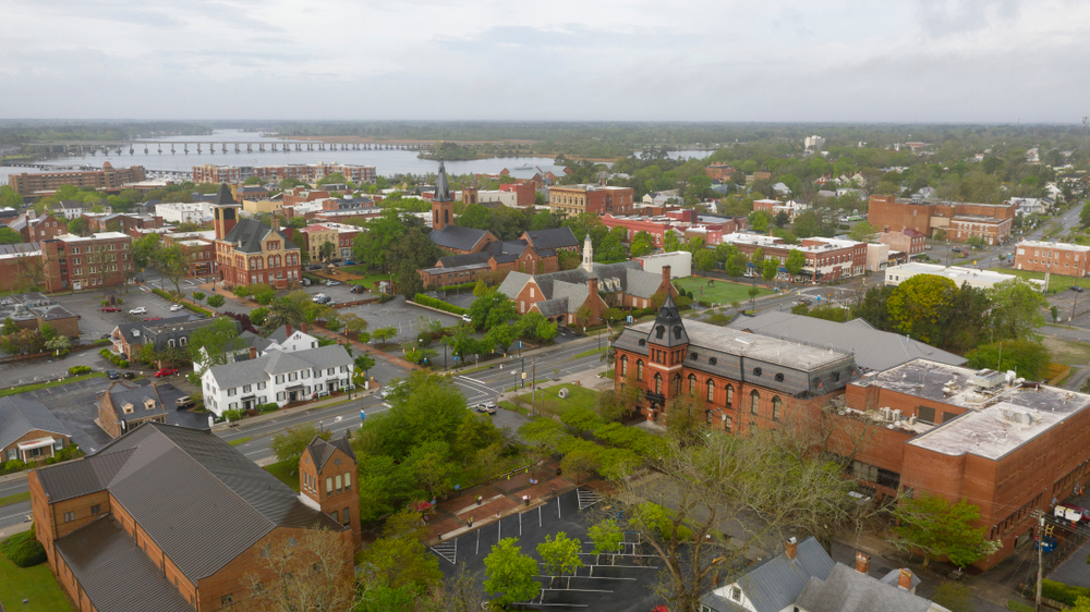 aerial photo of small north carolina town, water and bridge in the background