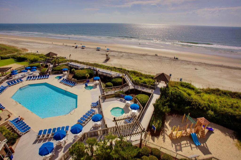 the stunning view of a pool leading to the beach in NC