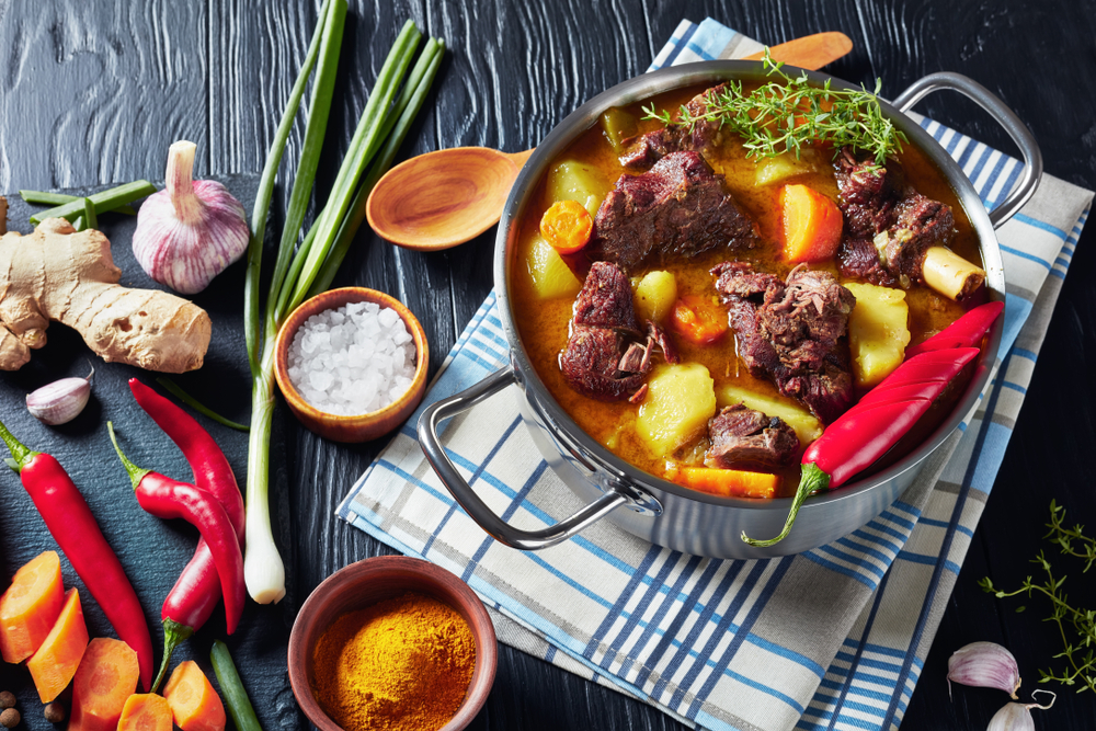 classic red meat and stew with roast vegetables and spices traditional to caribbean cuisine