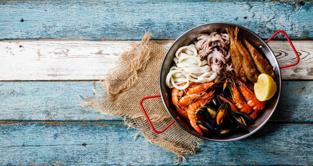 seafood in a boiling pot that's cooked to perfection and ready to be enjoyed! Seafood is a classic menu item at some of the best restaurants in Wilmington NC