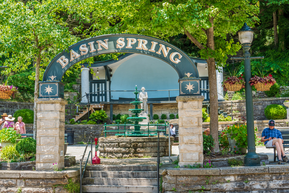 large archway opening to basin springs, one of the many natural mineral springs, one of the best things to do in eureka springs!