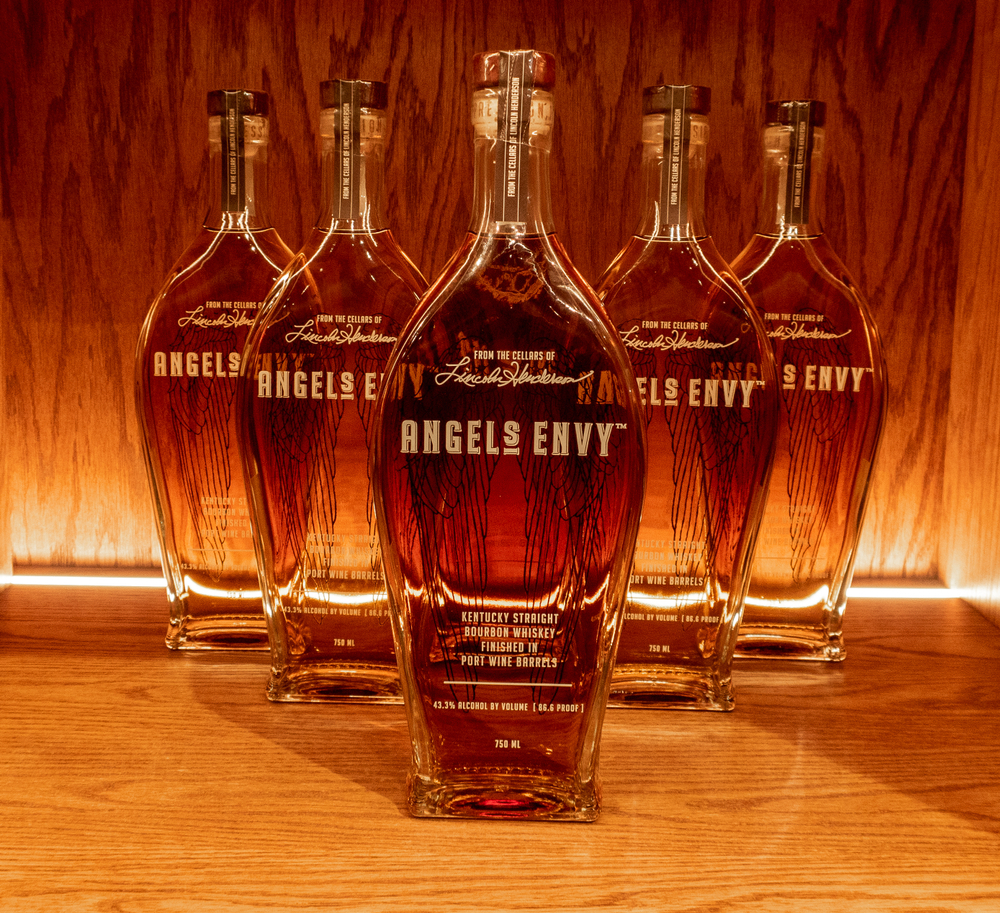 whiskey container lined up on a shelf