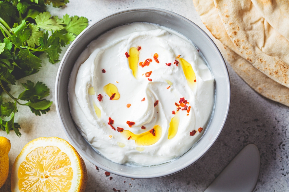 Whipped feta dip with pita bread, lemons and coriander. 