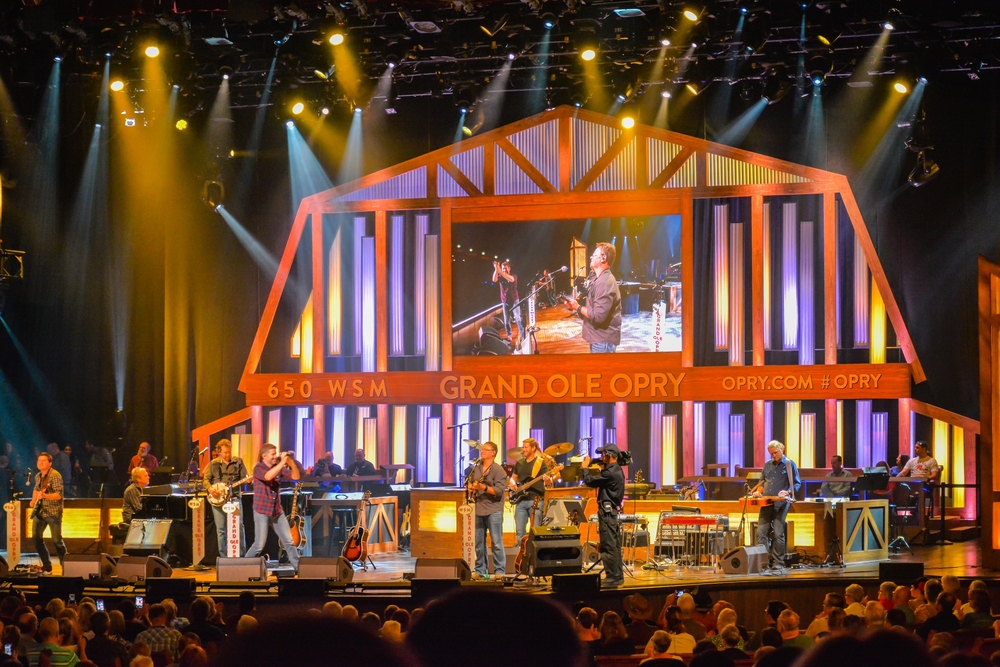 Musicians on stage at the Grand Old Opry Show, one of the best things to do in Nashville at night. 