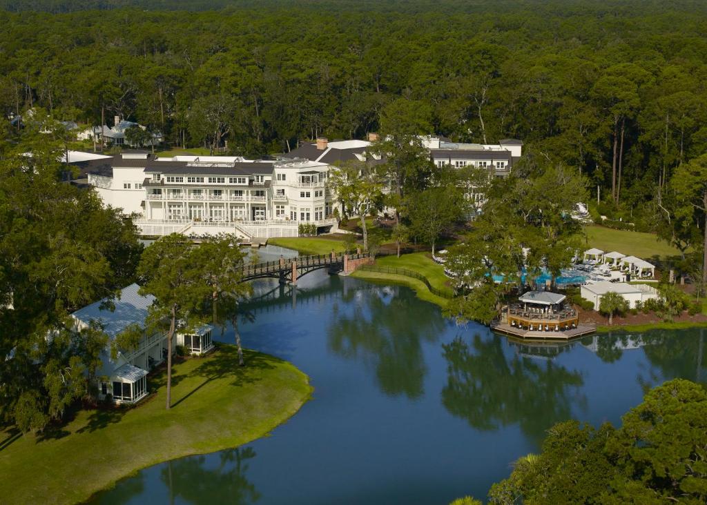 The montage resort is set in the low country with a lake, pool, and resort int he background 