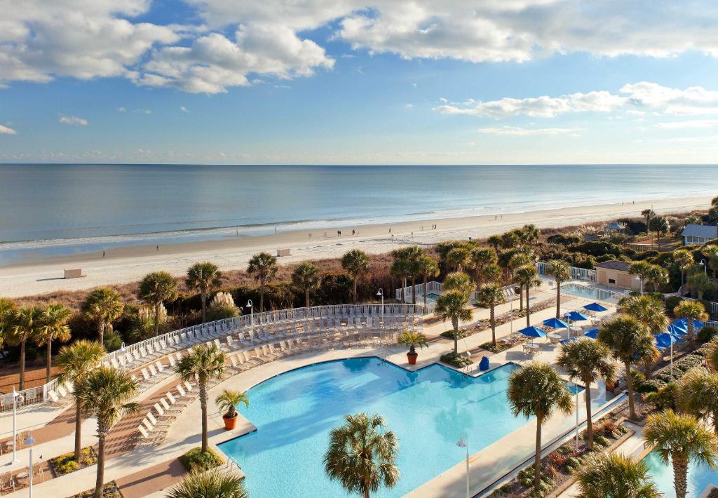 The pool area with palm trees overlooking the Atlantic Ocean in Myrtle Beach