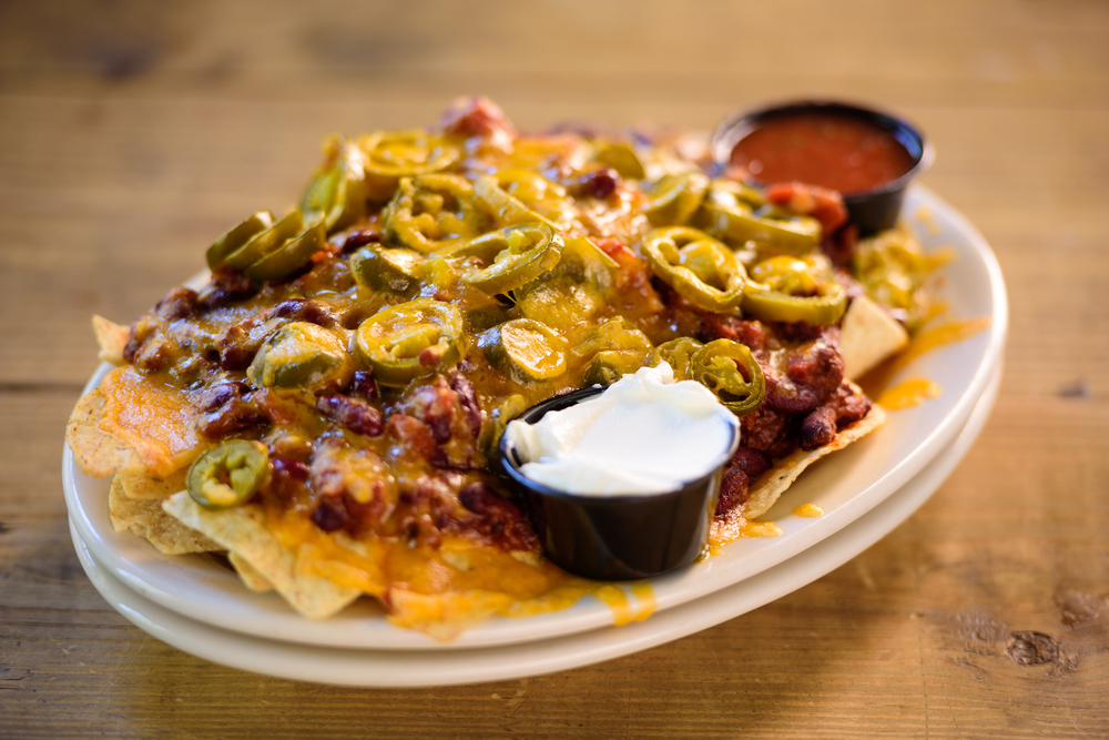 loaded nachos from one of the best restaurants in biloxi. nachos have meat, cheese, peppers on top