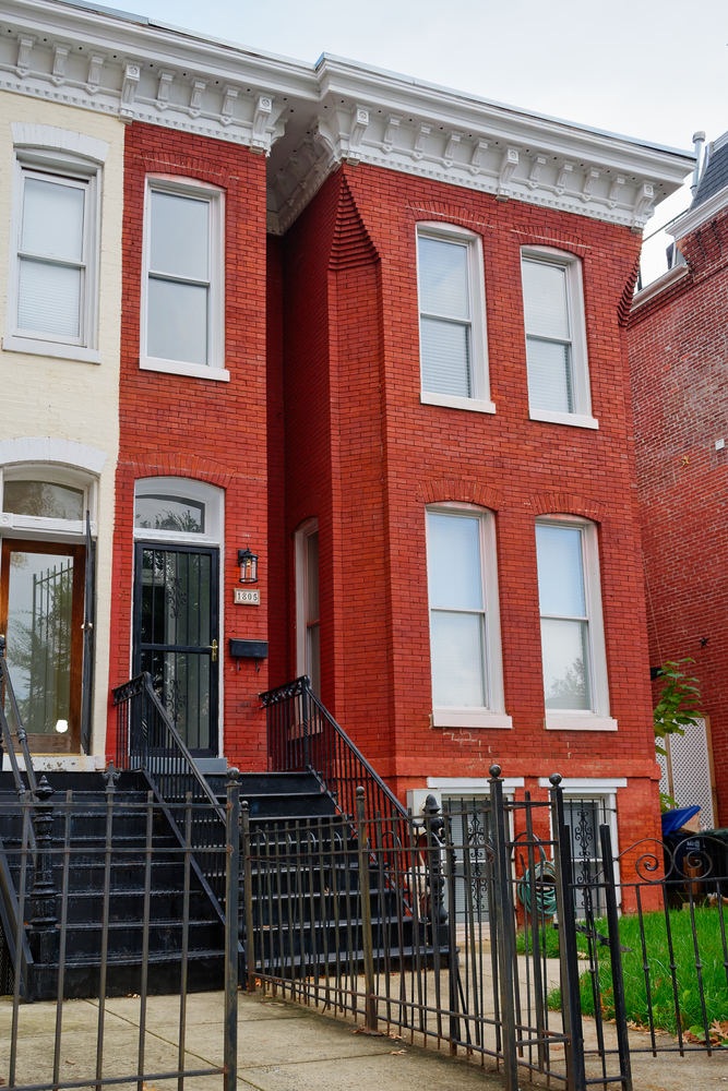 The front of a bright red brick row home in Washington DC that was the home of famous Jazz musician, Duke Ellington