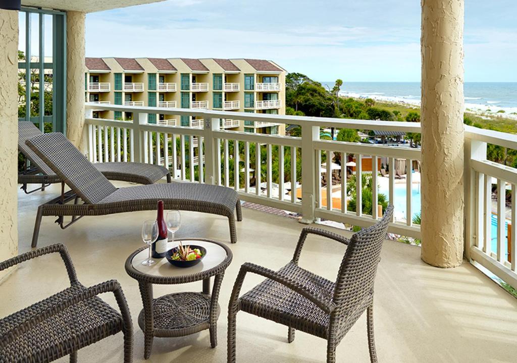 omni hotel outdoor patio with wine overlooking the pool ocean and the beach resort