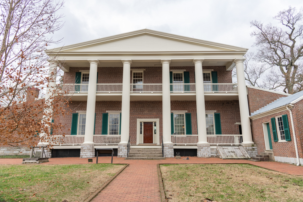 Front facade of the Hermitage with pillars and brick walls.