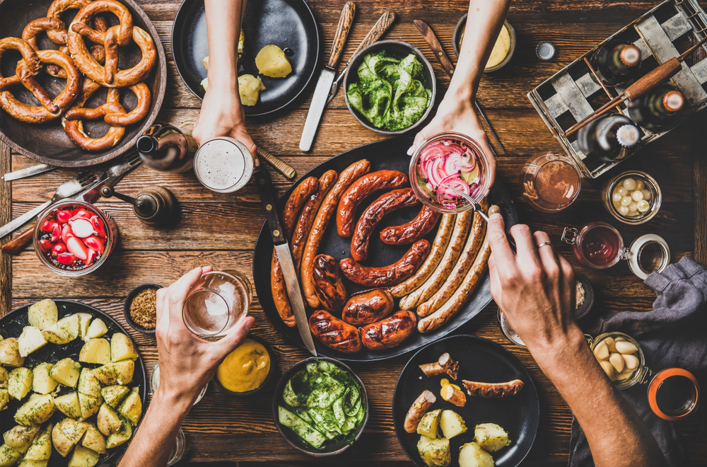 A biergarden with sausages pretzels and so many yummy German snacks   