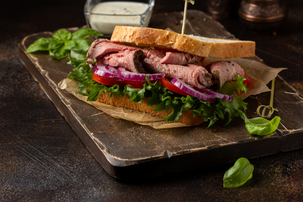 a wood slab of a delicious looking roast beef sandwich featured at a great gastropub