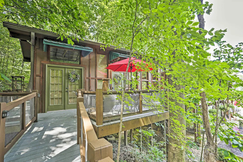 view of the back deck and welcoming double doors of the Treehouse Retreat.