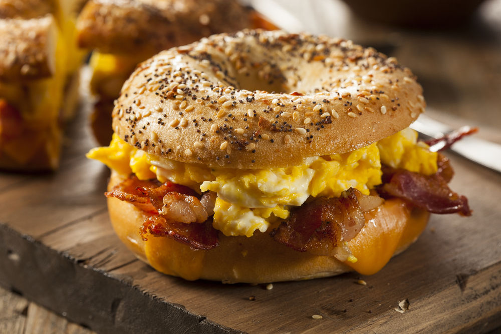 photo of an everything bagel breakfast sandwich with eggs and bacon, a sandwich you might find at one of the best places for breakfast in Memphis 