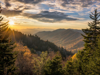 some of the best things to do in Cherokee involve nature! this is a great aerial shot of the great smokey mountains National Park at sunset!