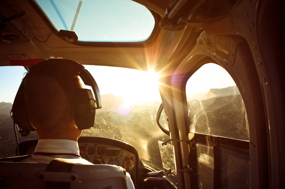 a helicopter ride at sunset with a pretty sun 