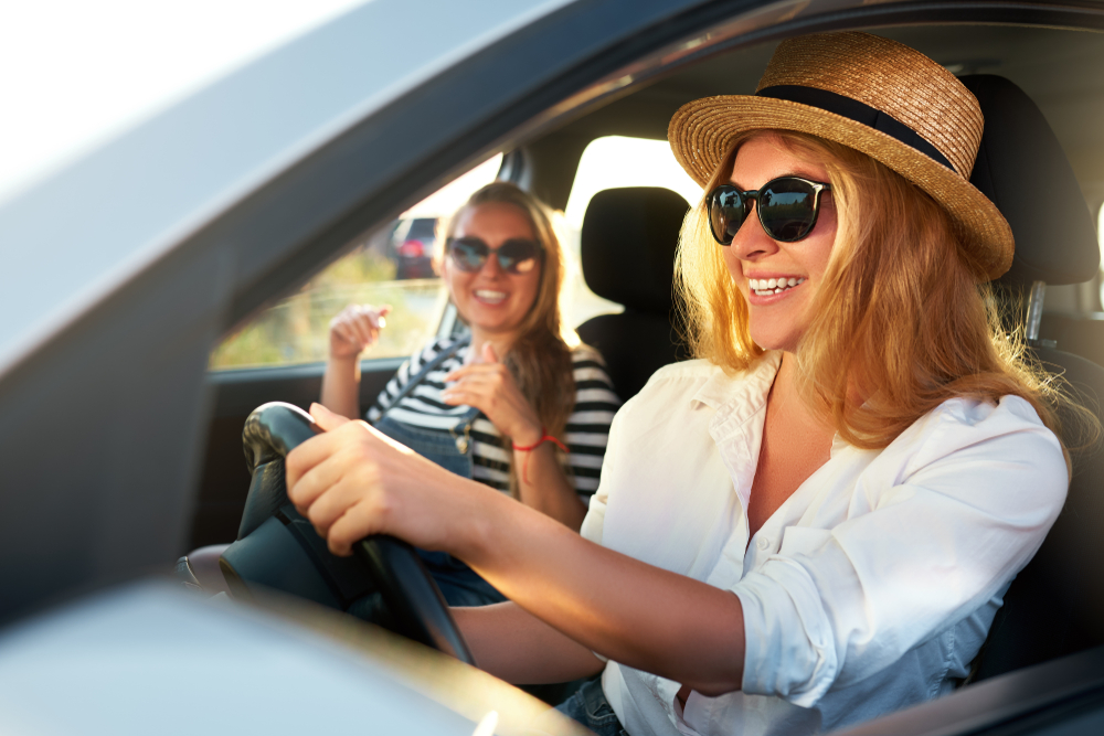 two girls driving along the road on a guided tour 