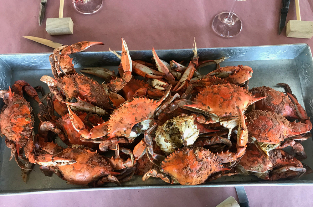 a plate full of blue crabs 