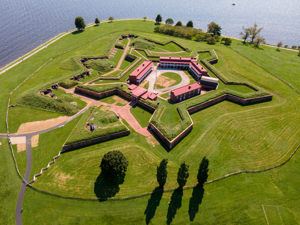 Fort McHenry from the sky with beautiful green grass and historic buildings 