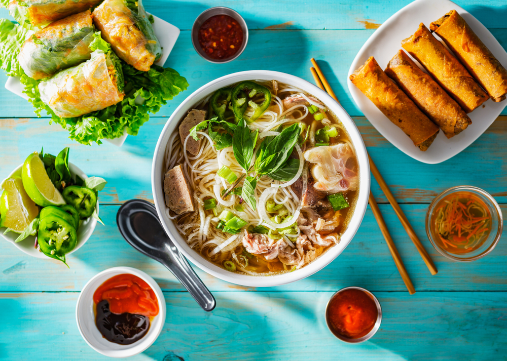 a bright image of some delicious vietnamese dishes and tastes on a bright blue table!