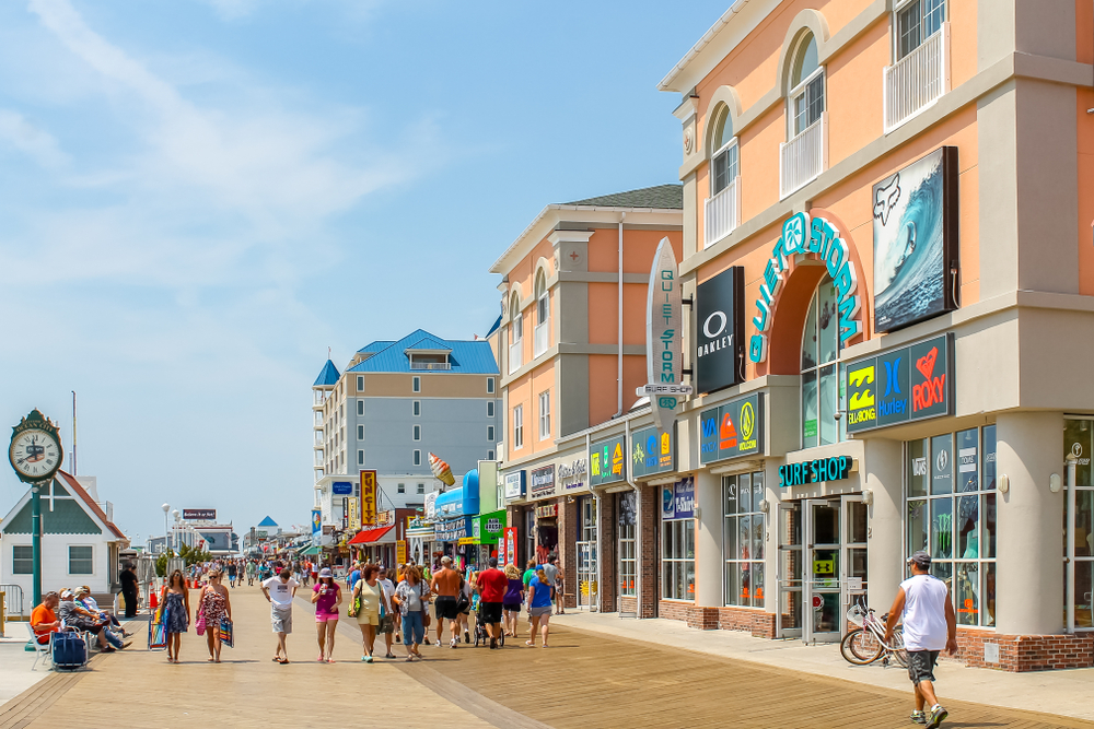 People strolling on the famous Ocean City Boardwalk. This is one of the best things to do in Ocean City. 