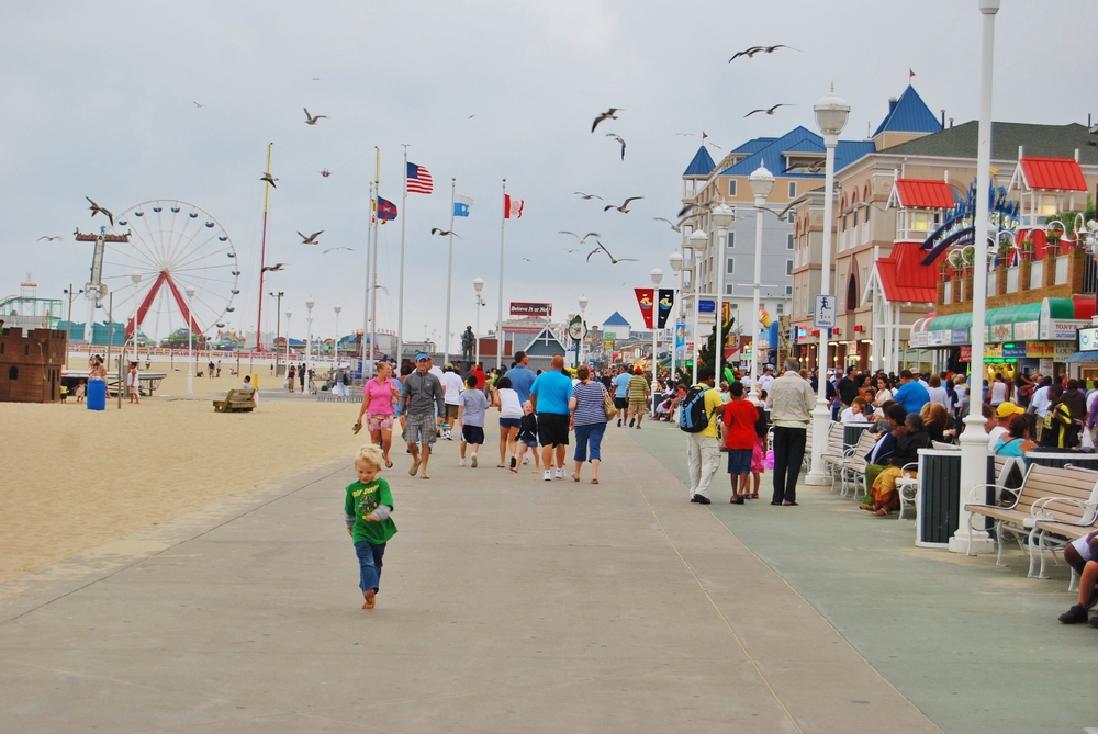 People walking ,and having fun at the famous Beach boardwalk with many attractions.