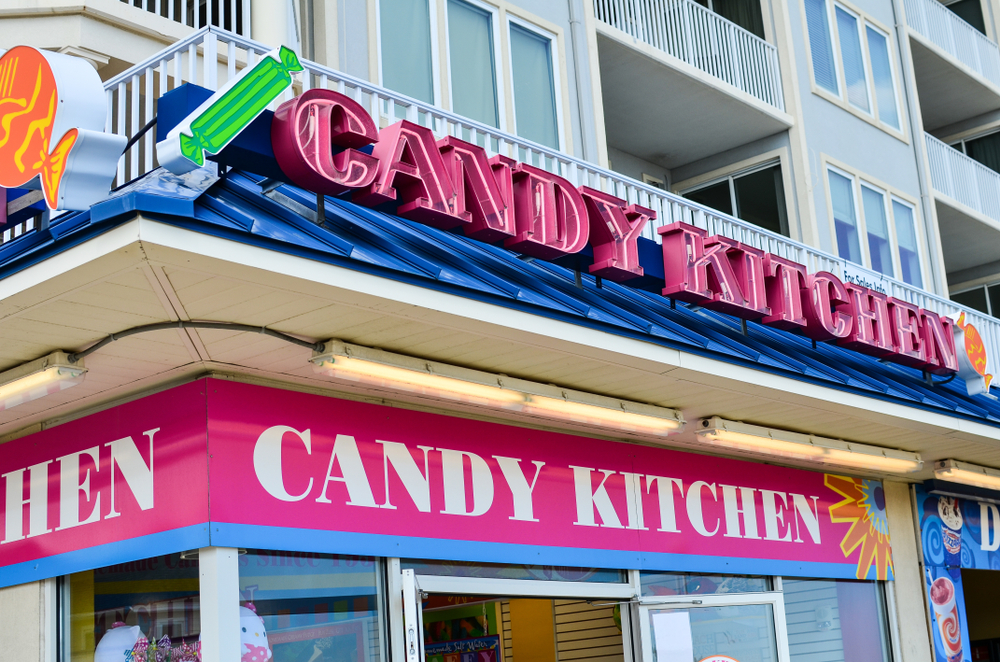 Exterior of a Candy Kitchen storefront along the boardwalk in the tourist town of Ocean City MD