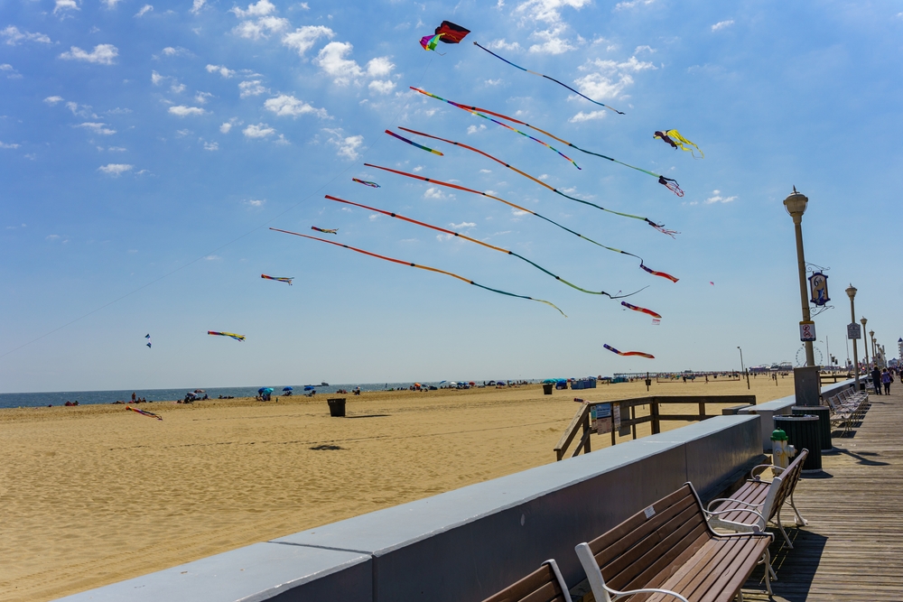 Kites flying on the beach near the Ocean City Boardwalk on a sunny day at the end of summer. This is one of the best things to do in Ocean City