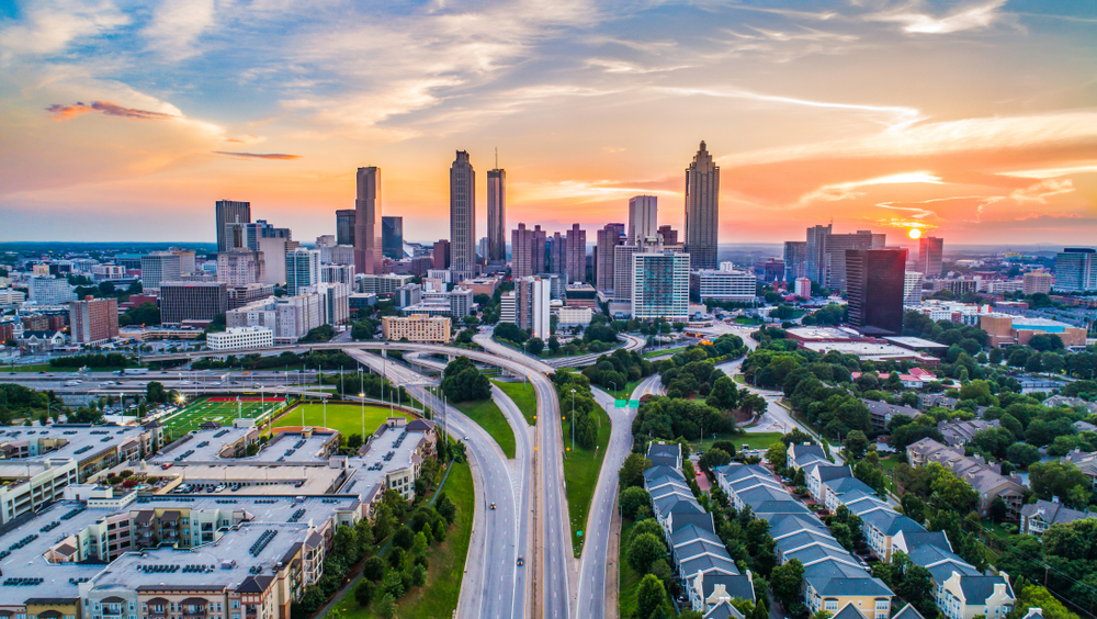 The city scape of Atlanta during a sunset shows all the tall buildings, many of which feature some of the best brunch in Atlanta. 