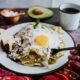 nachos on a plate with sunny side up egg at one of the best Atlanta brunch restaurants